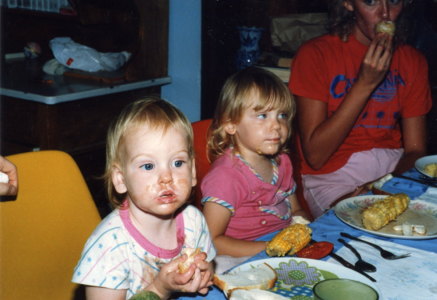 Toddler Rebekah with butter (from corn on the cob) all over her face