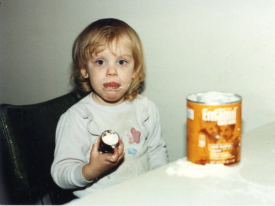 Young Anna eating powdered formula