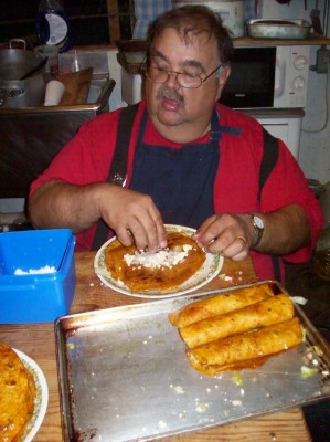 Jim rolling enchiladas