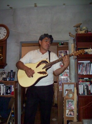 Pastor Pepe on the guitar