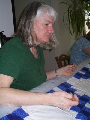 Mom quilting a wedding gift for her son