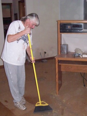 Mom sweeping up during renovations