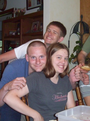 Debbie being hugged by the John's