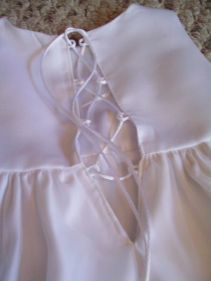 Laced backing on flower girl dress