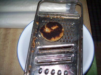 Burnt biscuit on cheese grater