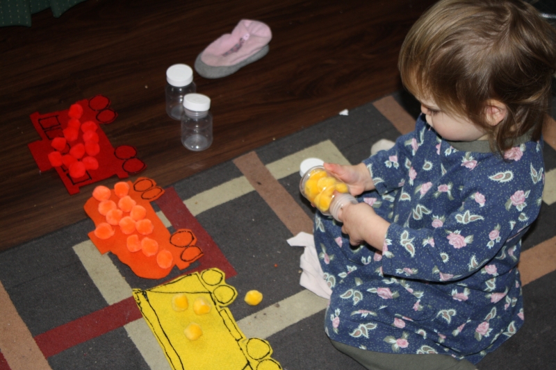 Tirzah Mae plays with her "Freight Train" activity