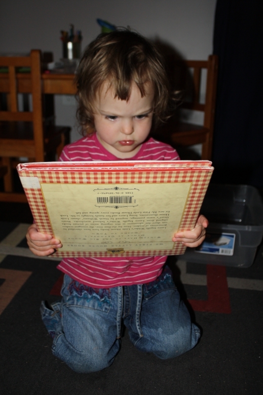 Studying the upside-down cover rather intently