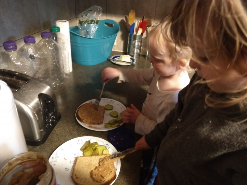 Making Peanut Butter and Dill Pickle Sandwiches