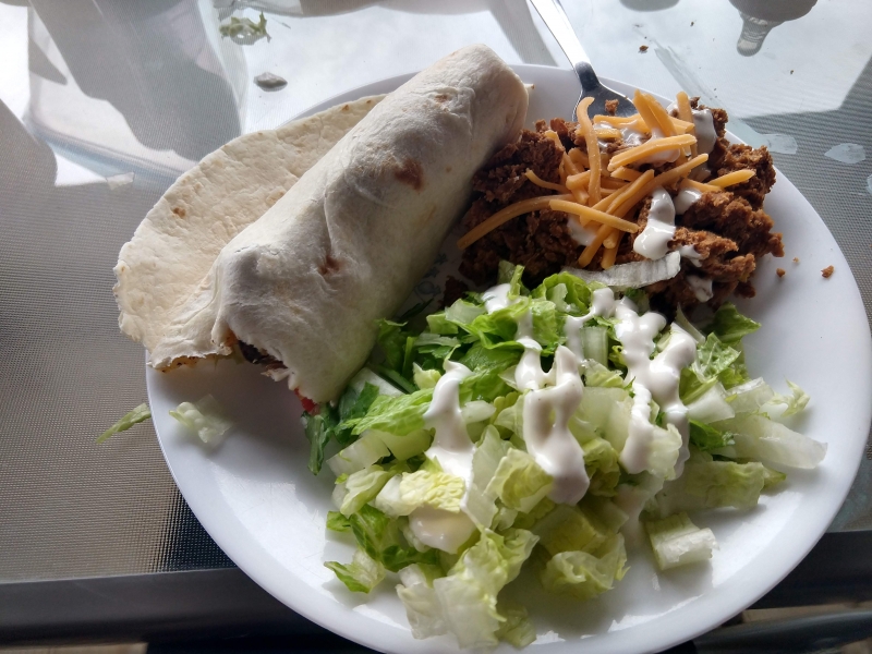 Beef Fajitas, lettuce salad, burrito beans