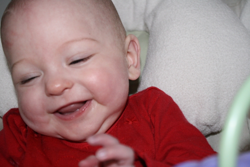 Tirzah Mae smiles as she swings