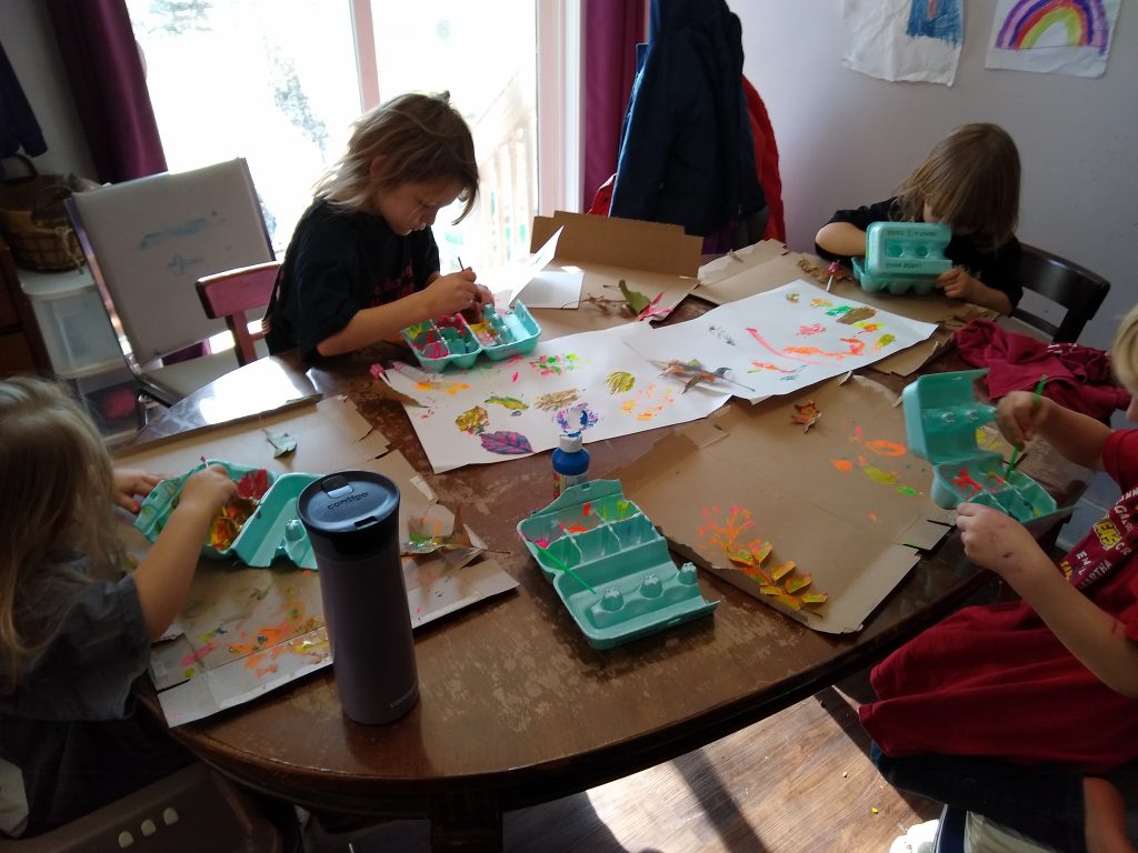 Kids painting leaves and making leaf prints